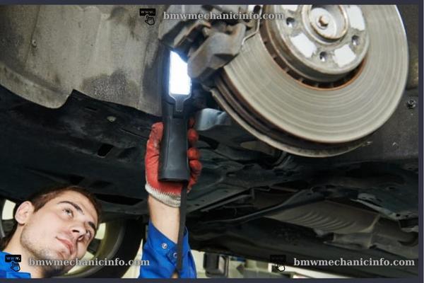 Experienced BMW mechanic does brake inspection
